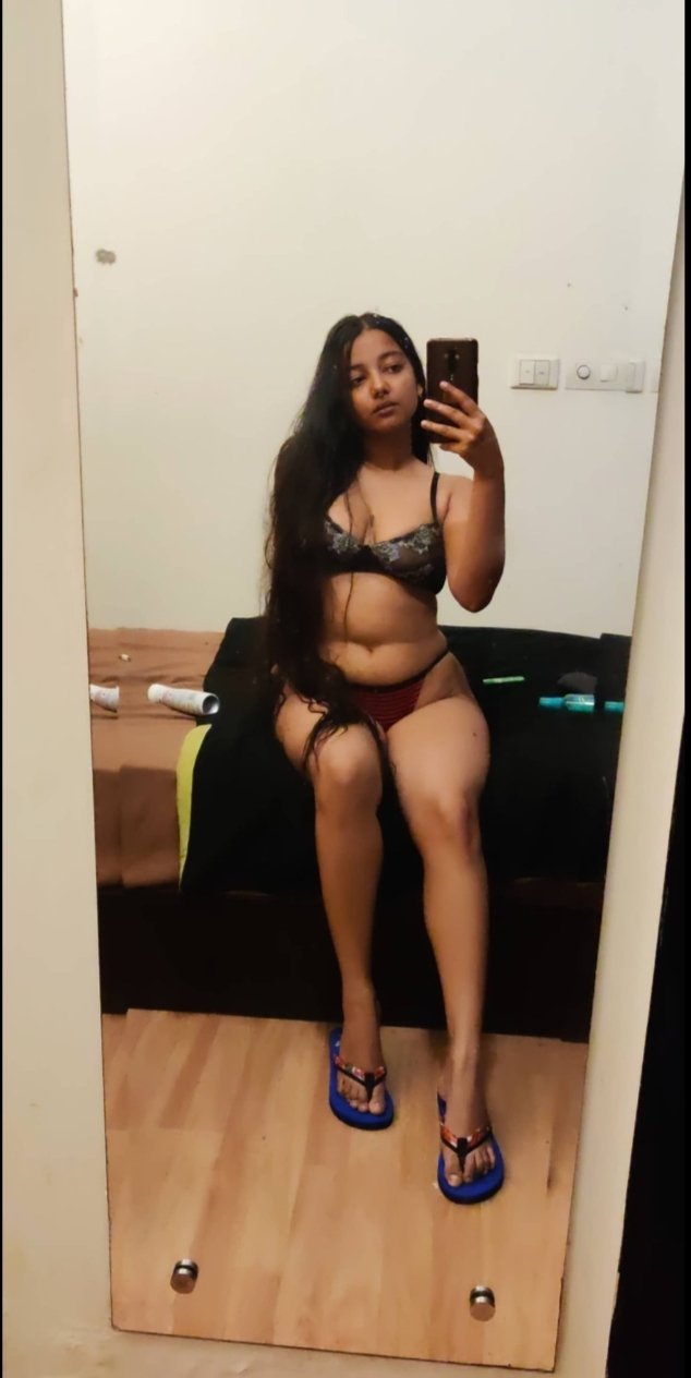 Priyai, Indian escort in Wellington Te Aro, smiling with red lipstick