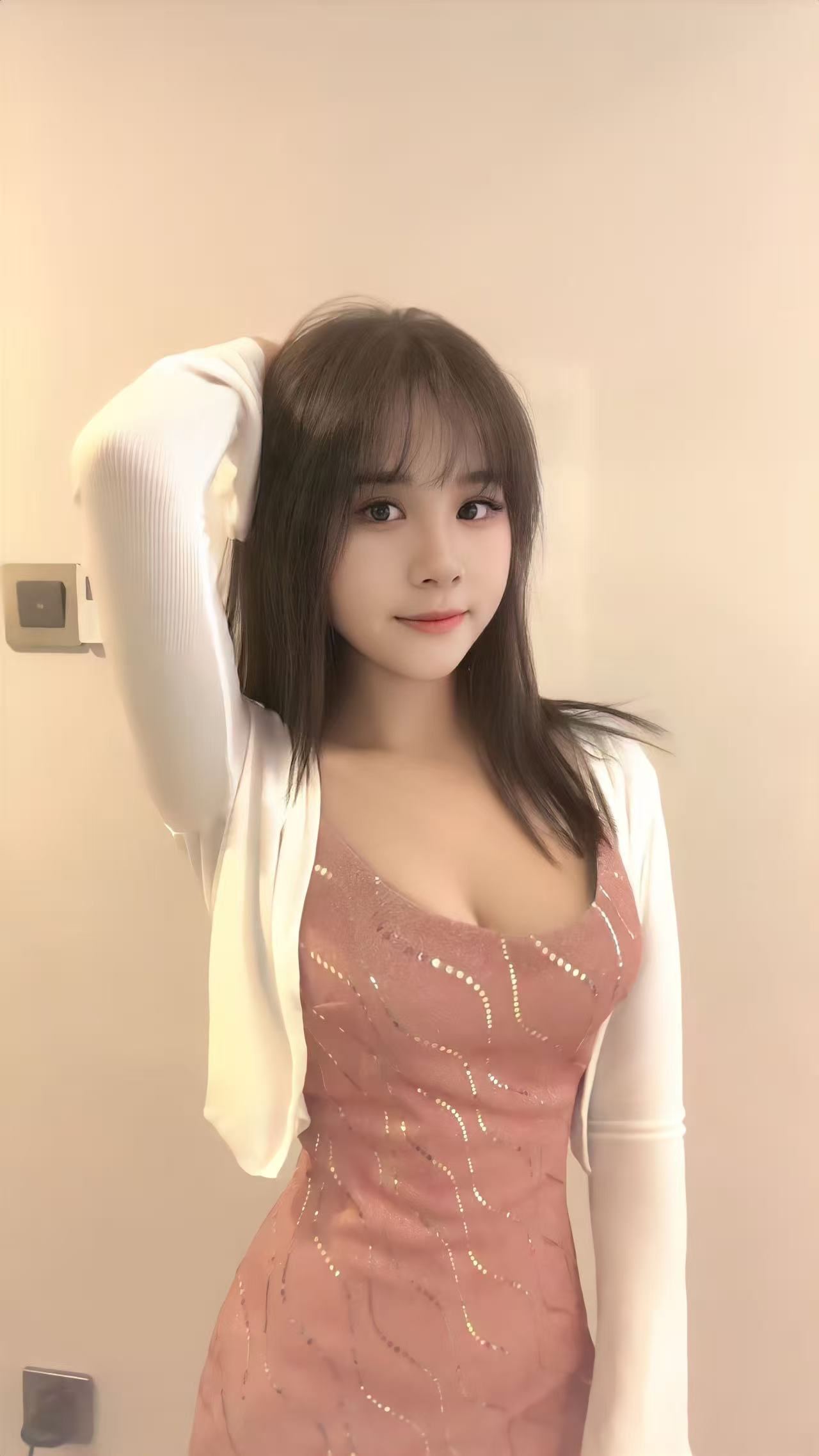 Eva, Taiwanese escort in Auckland, smiling softly for the camera